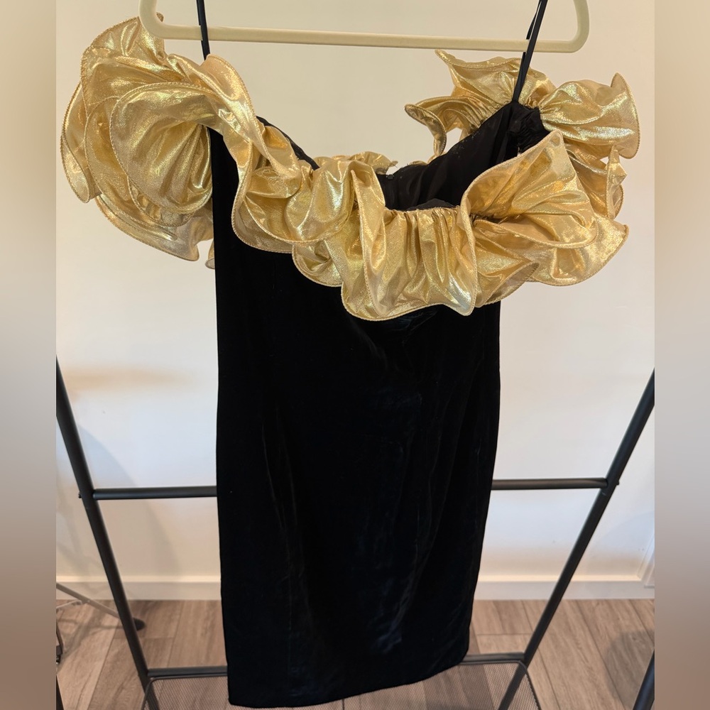 Short black dress with gold off the shoulder ruffles in size 12